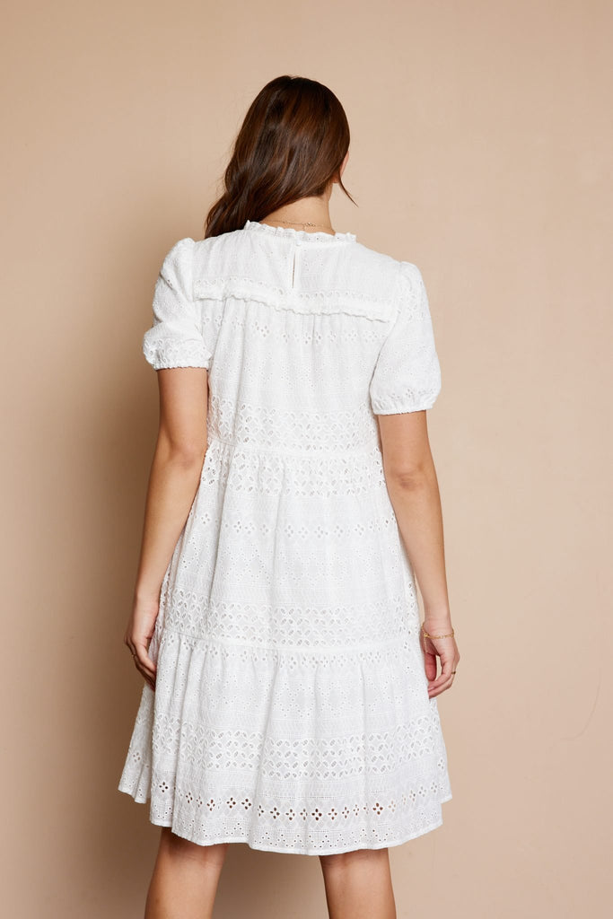 Get ready to turn heads in this Eyelet Tiered Dress! Featuring a playful tiered design and crisp white eyelet fabric, this dress is perfect for any occasion. Don't miss out on the opportunity to make a statement with this unique piece.&nbsp; <span style="color: var(--dark-text-color); font-family: -apple-system, BlinkMacSystemFont, 'San Francisco', 'Segoe UI', Roboto, 'Helvetica Neue', sans-serif; font-size: 0.875rem;">Eyelet Tiered Dress</span>