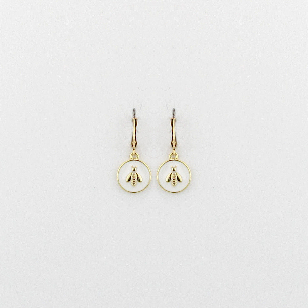Unveil your love for classic designs with our Bria Bee Earring. This delightful piece from La Vie Parisienne features an enchanting enamel earring with a gold bee at its center. Crafted following traditional French artisan techniques, the earring beautifully exhibits the delicate details of historic designs. Handmade and hand-set with Swarovski crystals, it is a perfect blend of classic European findings and historical American pieces. A timeless piece.