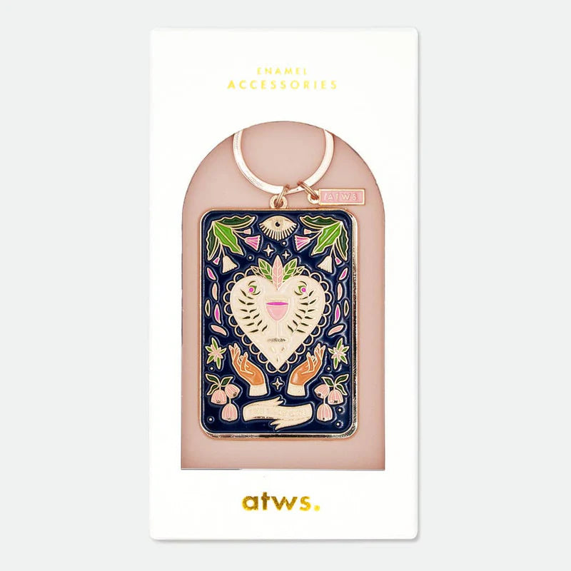 This keychain is sure to add some charm to your keys! Featuring a gold plated Tarot card with colorful enamel details, it's perfect for the mystical and playful at heart. Never lose your keys again with this unique and eye-catching accessory.