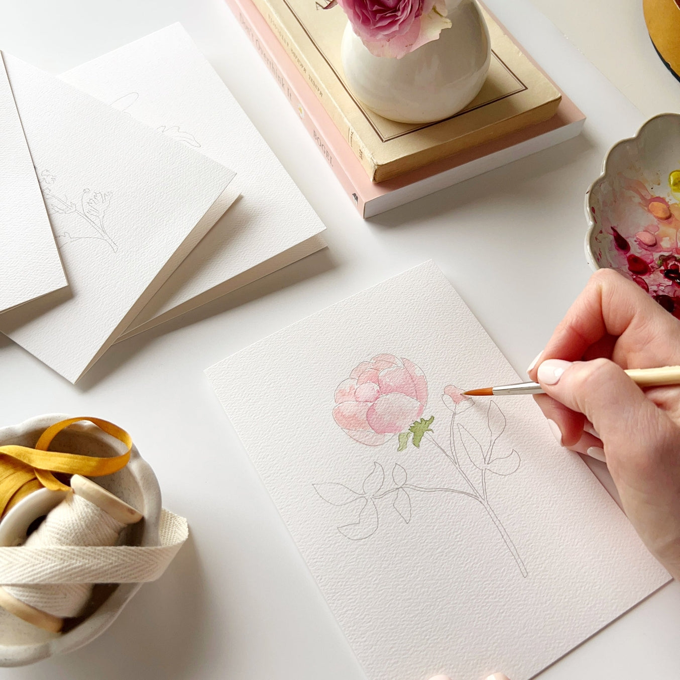 Paint your own special cards to send to loved ones! Sketches are printed on the front of each card with simple instructions for you to paint in with watercolors. You'll receive eight cards with two of each illustration: hydrangea, garden rose, delphinium and daisy. Perfect for artists of all ages!