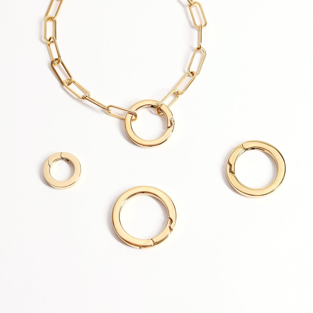Enhance your jewelry designs with our NEW carabiner charm clasps! Designed to be used for quicker necklace making and charm keeping, this is the perfect way to turn your unfinished chains into necklaces and bracelets that are charm-friendly and on trend.
The Circle Carabiner Charm Clasp features a polished finish made of 316L stainless steel with an easy-to-open, secure spring clasp.