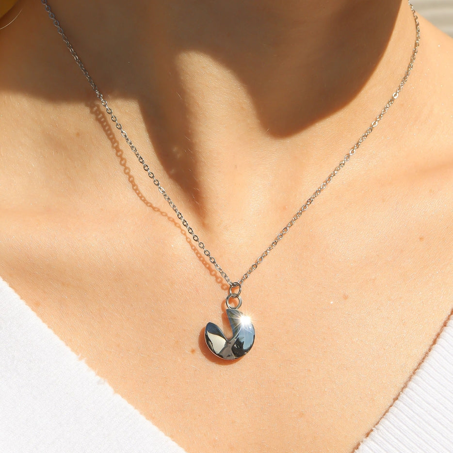 Carry a little bit of wisdom and luck wherever you go with this adorable fortune cookie charm. A symbol of positivity and surprises, this charm serves as a daily reminder that life’s best moments often come unexpectedly. Whether it's inspiring words or good fortune, this cute keepsake is sure to add a touch of magic to your day.