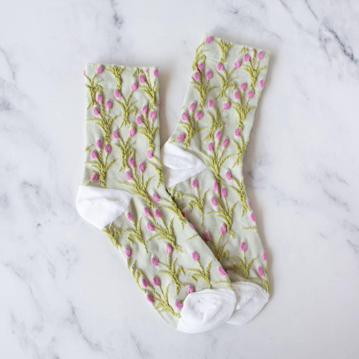 Get a vintage vibe with our Vintage Tulip Casual Socks. Made with care, these socks add a classic touch to any outfit. Enjoy the comfort and style of our unique design, perfect for any casual occasion.