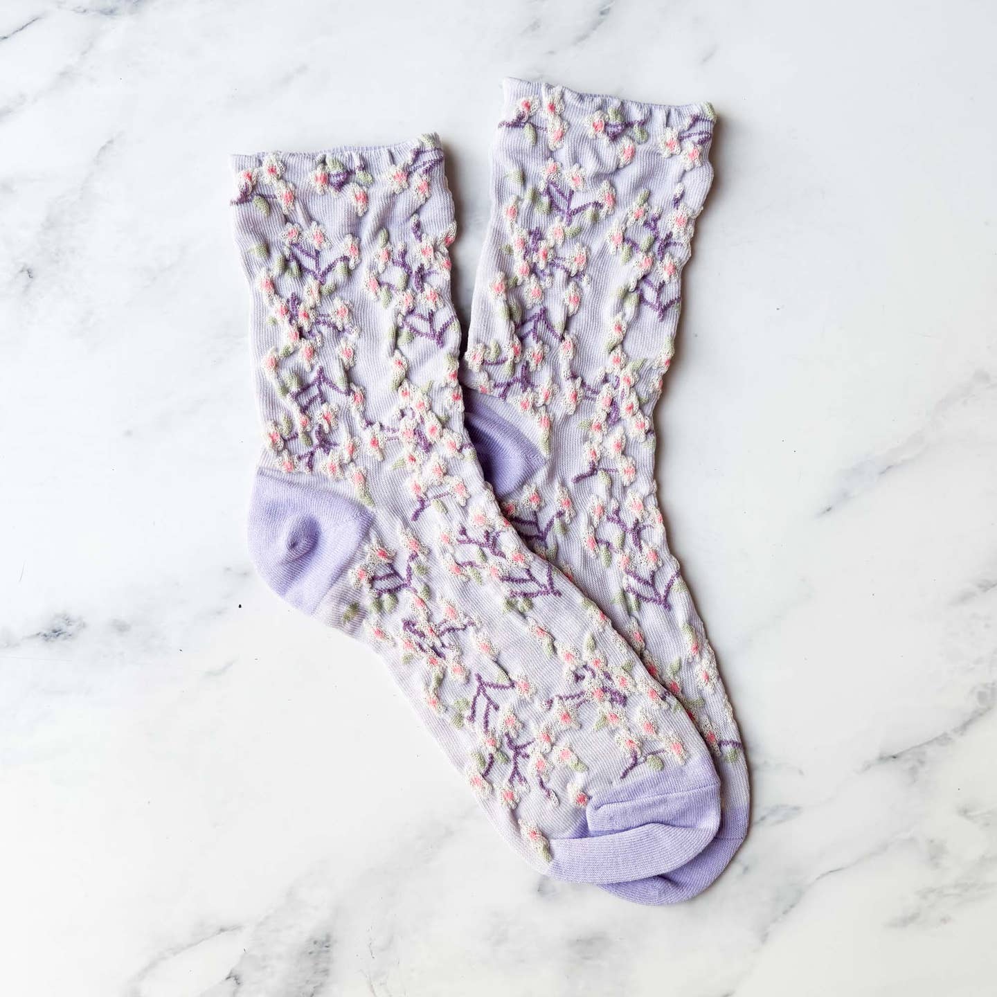 Perfect for adding a vintage and romantic touch to your wardrobe. These socks are not only stylish, but also comfortable and high-quality. Elevate any outfit with these must-have statement pieces.