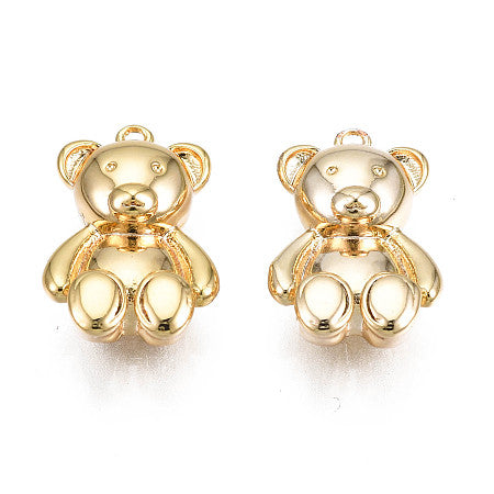 Elevate your jewelry game with our Gold Bear Charm. Add a touch of shine and charm to your outfit with this versatile piece. Perfect for bracelets or necklaces, this gold colored bear charm will surely make you stand out from the crowd.