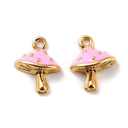Add a touch of nature to your jewelry collection with our gold Pink Petite Mushroom Charm. Each charm showcases a mushroom with a bright pink enamel color, adding to your accessories a whimsical and enchanting touch.