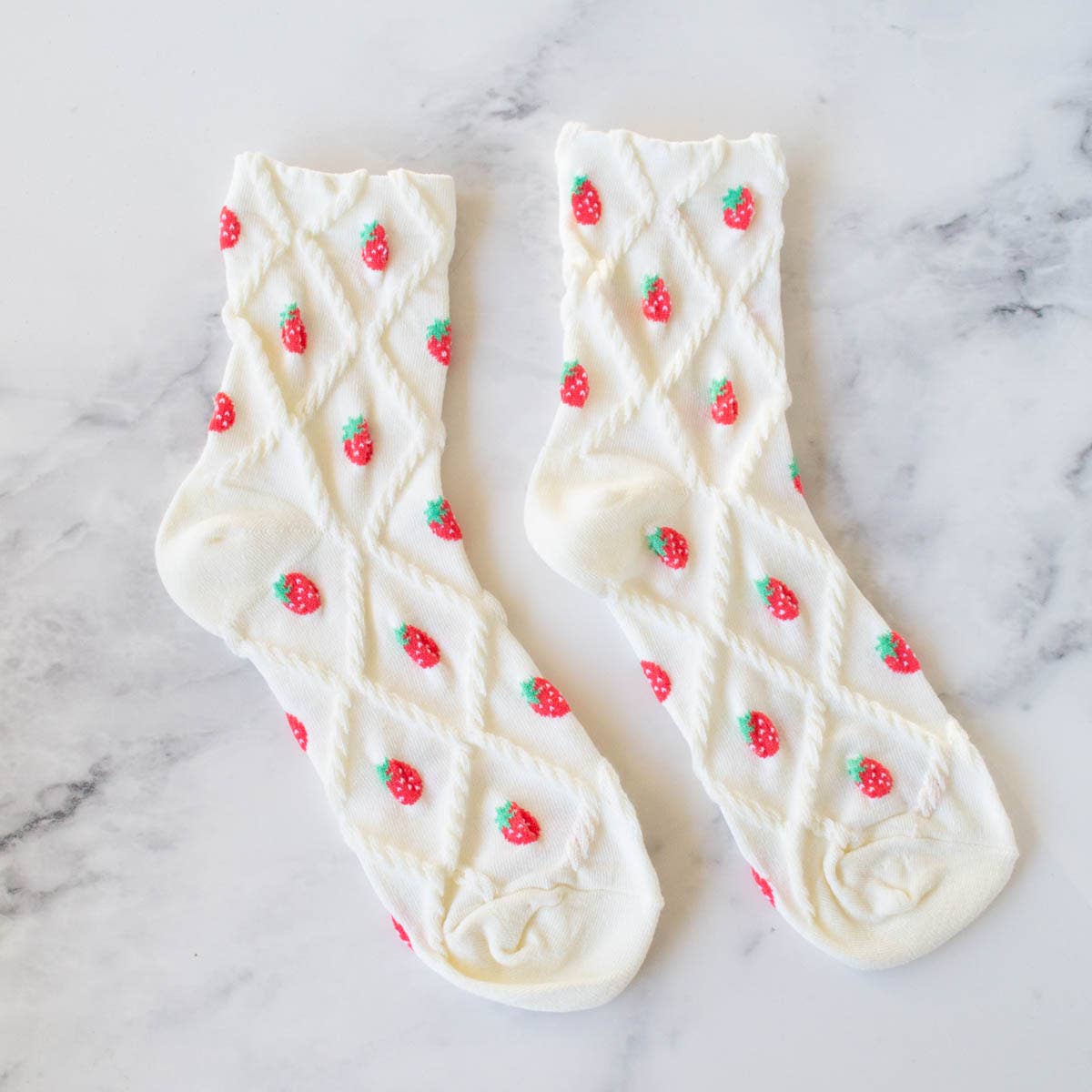 Elevate your sock game with our Strawberry Diamond Shape Socks! Featuring a whimsical diamond design and sweet strawberry details, these crew socks will add a pop of fun to any outfit. Enjoy ultimate comfort with the stitched design and soft white base. Stand out and stay stylish with every step.