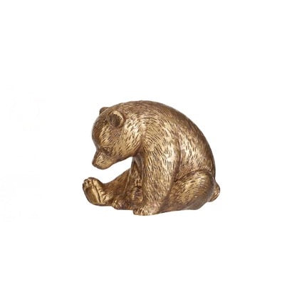Gold bear figurine on a white background
