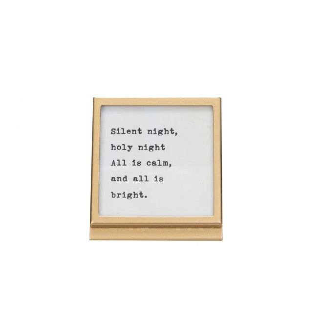 Framed print with 'Silent night, holy night, All is calm, and all is bright.' text on a white background