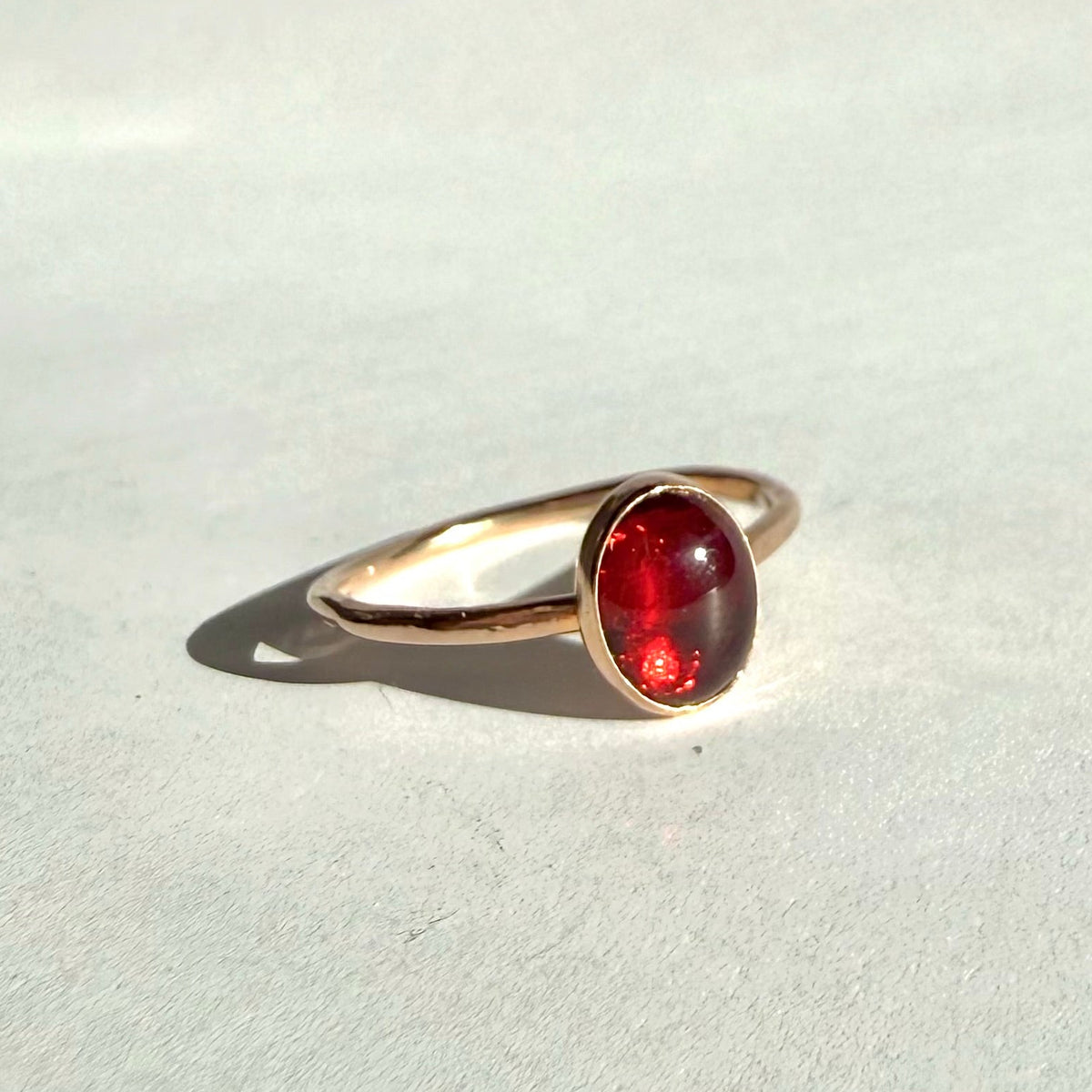 RED GARNET OVAL GEMSTONE RING IN GOLD