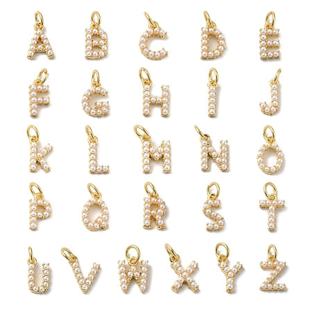 Add a personal touch with these elegant white pearl and gold-plated letter charms. Perfect for customizing a bracelet or necklace, they offer a timeless, sophisticated way to celebrate a special initial or name. These charms are versatile, allowing you to create meaningful jewelry that carries your unique story every day.
Details:
A-Z available
Rack Plating Brass Charms with ABS Plastic Imitation Pearl
Long-Lasting Real 18K Gold Plated, Lead Free & Cadmium Free
Size: 10.5x2.5x2.5mm, hole:3mm