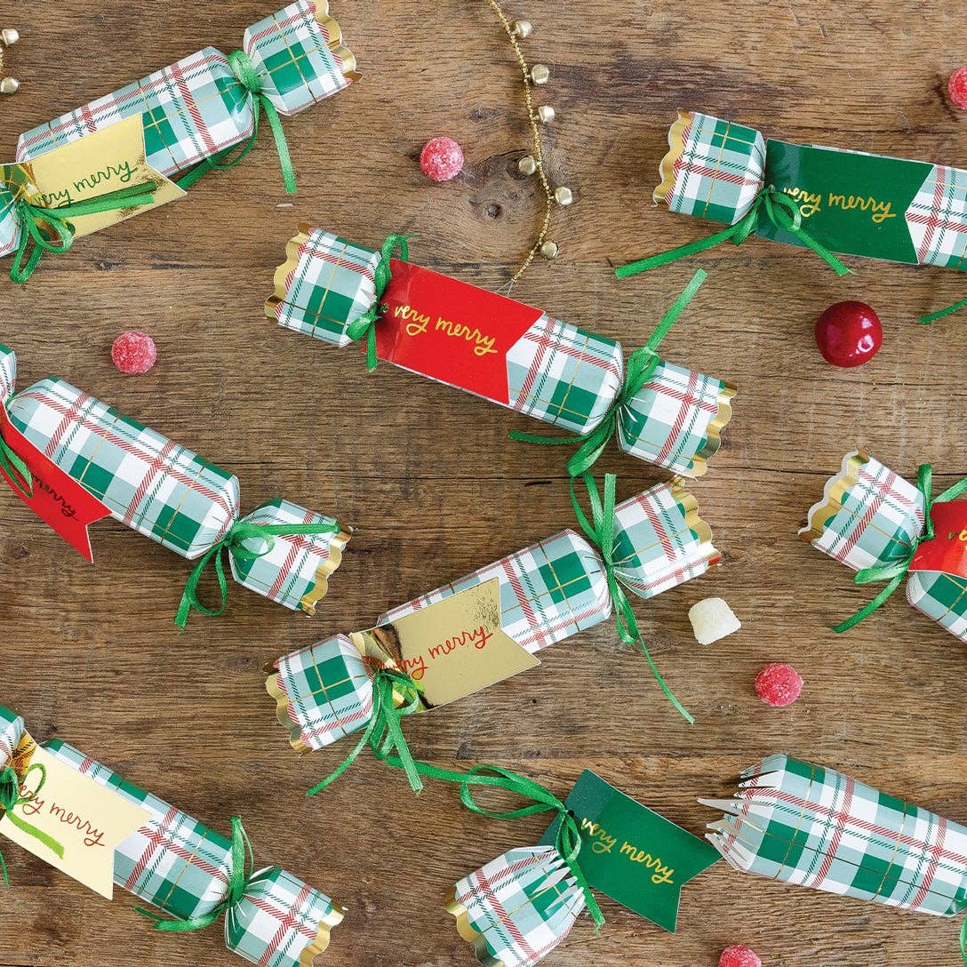 Celebrate the season in style with these classic plaid Christmas crackers, topped with shimmering gold foil tags. Perfect for adding festive flair to your holiday table, they bring fun surprises and a touch of elegance to every celebration.
Details:
12 party crackers: Each contain a dice, a game, and a tissue crown
Gold foil tags included