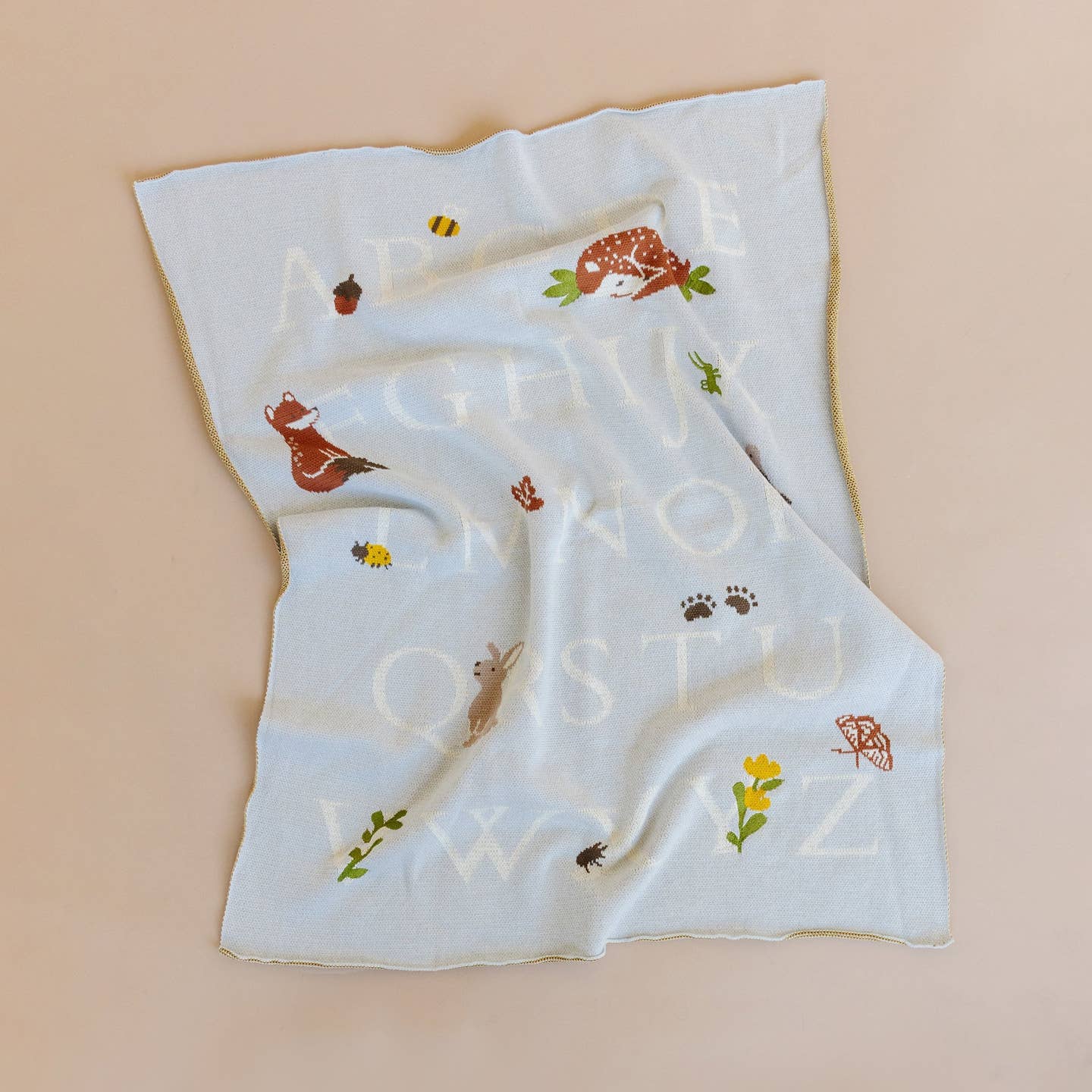 Wander through the woods and learn the alphabet with Rusty Fox. Share his love of nature and reading with this 100% GOTS certified organic cotton blanket, ensuring the softest and safest embrace for your baby's delicate skin. Wrap your precious bundle in comfort and style with this eco-friendly, irresistibly cute baby blanket that promises both warmth and peace of mind. Pair with Rusty Fox Plush Toy and Rattle.
Details:
Designed in Salt Lake City
Embroidered details
Measures 32 x 40 in
100% Organic Cotton