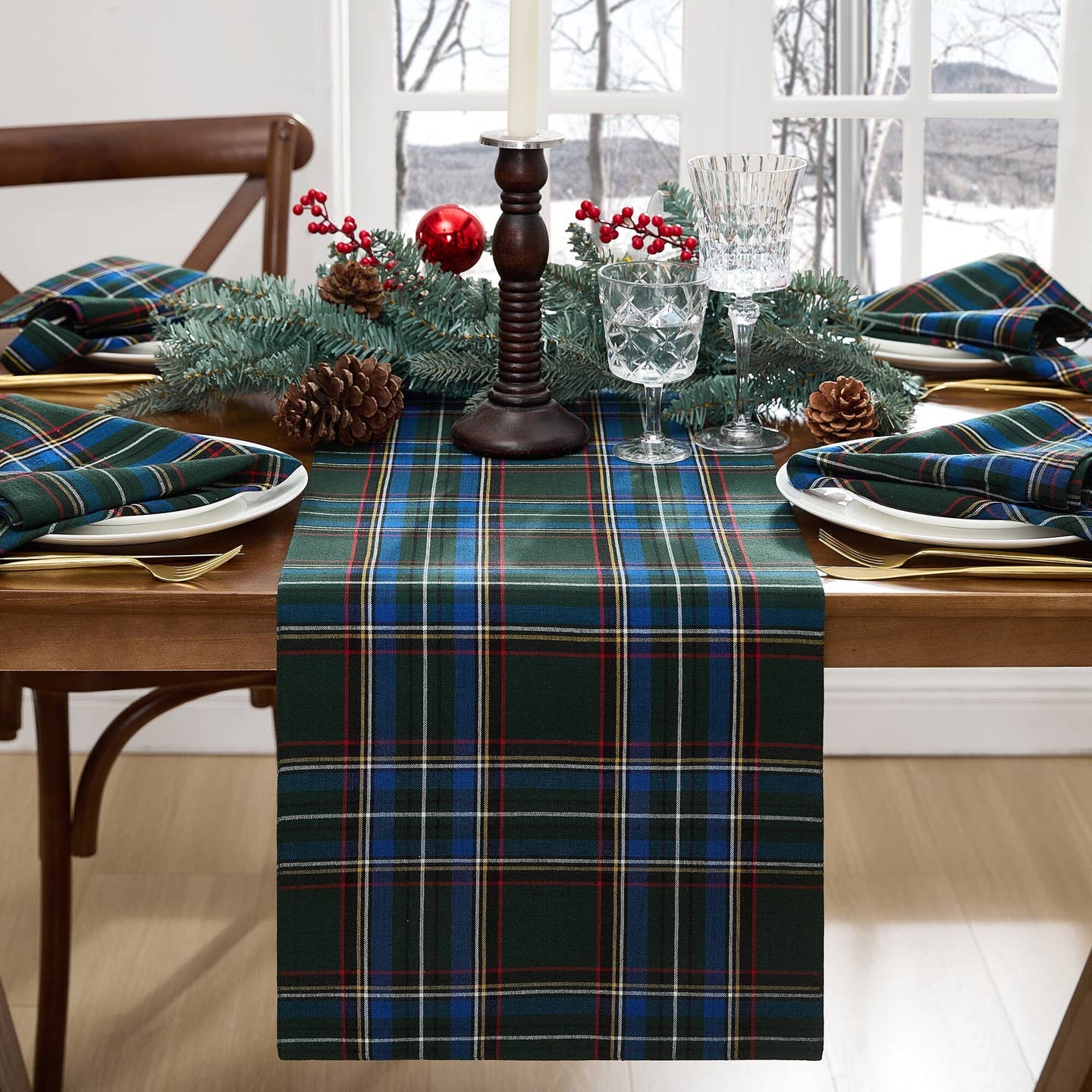 Elevate your holiday gatherings with our exquisite Stowe Tartan Plaid Table Runner. Versatile and elegant, this plaid table, console, mantle or buffet runner displays a yarn-dyed pattern in a festive color palettes featuring shades of Christmas red, hunter green, royal blue, gold and white to compliment a variety of seasonal dinnerware. Woven using premium quality 100% cotton, this traditional runner is available in two sizes and features a hemmed edge for added protection.