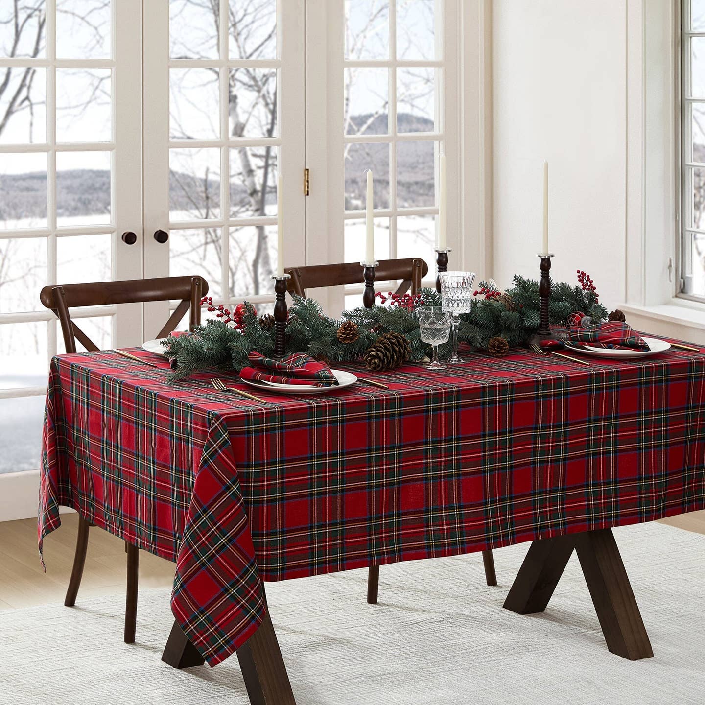 Elevate your holiday gatherings with our exquisite Stowe Tartan Plaid Tablecloth. Versatile and elegant, this plaid table, console, mantle or buffet runner displays a yarn-dyed pattern in a festive color palettes featuring shades of Christmas red, hunter green, royal blue, gold and white to compliment a variety of seasonal dinnerware. Woven using premium quality 100% cotton, this traditional table cover features a hemmed edge for added protection. Ideal for special occasions. Size 60” x 102”