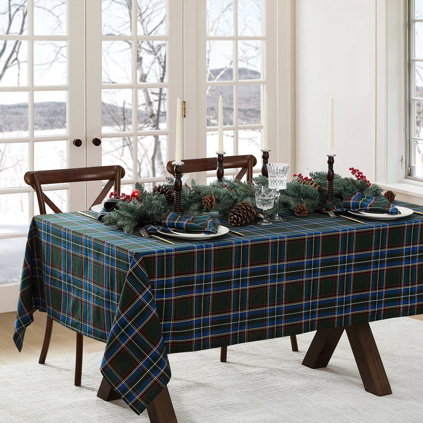 Elevate your holiday gatherings with our exquisite Stowe Tartan Plaid Tablecloth. Versatile and elegant, this plaid table, console, mantle or buffet runner displays a yarn-dyed pattern in a festive color palettes featuring shades of Christmas red, hunter green, royal blue, gold and white to compliment a variety of seasonal dinnerware. Woven using premium quality 100% cotton, this traditional table cover features a hemmed edge for added protection. Size 60” x 102”