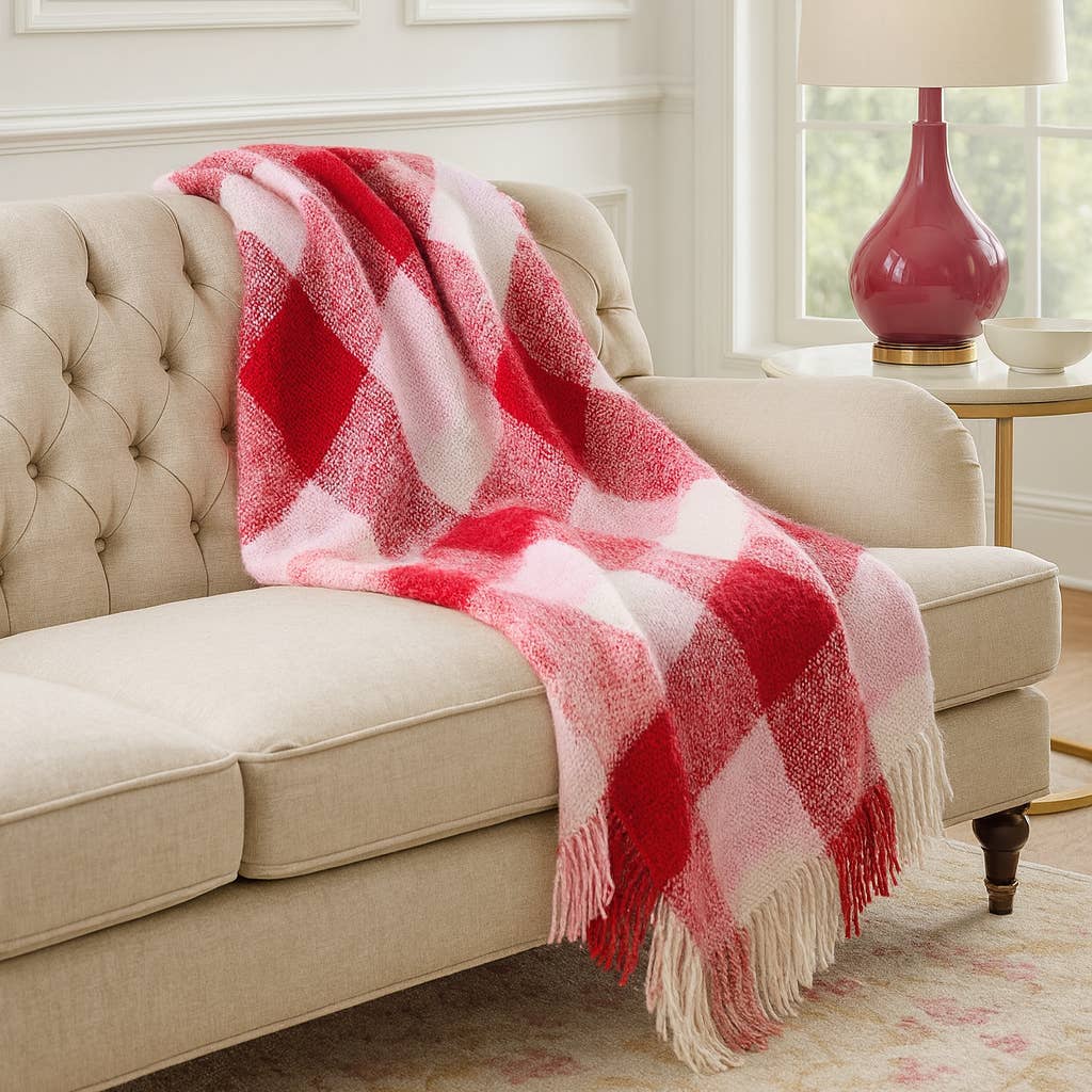 Whether you're taking a quick power nap or snuggling in with a good book, keep warm and comfy with the Faux-Mohair Plaid Throw Blanket from Fennco Styles. Plaid blanket makes a classic addition to your blanket collection, fringed edges add a fun touch.
Details:
Machine Washable
50"W x 60"L