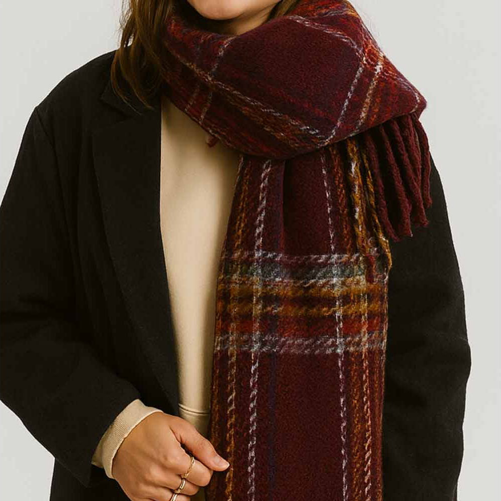 Wrap yourself in warmth and style with this burgundy plaid knit scarf. Crafted from soft, cozy yarn with a classic plaid pattern, it's the perfect layering piece for cooler days. The fringed ends add a charming, finished touch that elevates any outfit. Whether you're heading out for a casual stroll or dressing up your everyday look, this versatile scarf brings both comfort and character to your wardrobe.
Details:
100% Polyester
Casual, light fitting scarf
Size: 40*185cm