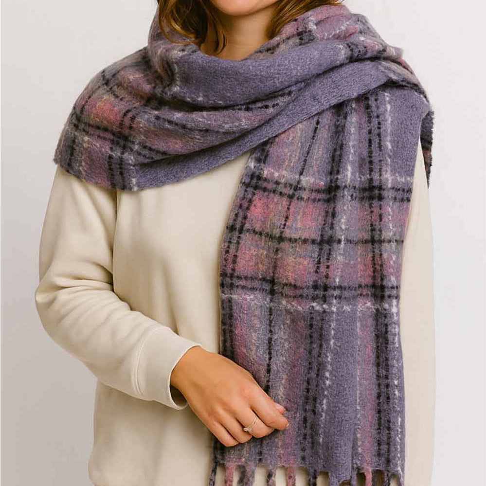 Wrap yourself in warmth and style with this lavender plaid knit scarf. Crafted from soft, cozy yarn with a classic plaid pattern, it's the perfect layering piece for cooler days. The fringed ends add a charming, finished touch that elevates any outfit. Whether you're heading out for a casual stroll or dressing up your everyday look, this versatile scarf brings both comfort and character to your wardrobe.
Details:
100% Polyester
Casual, light fitting scarf
Size: 40*185cm