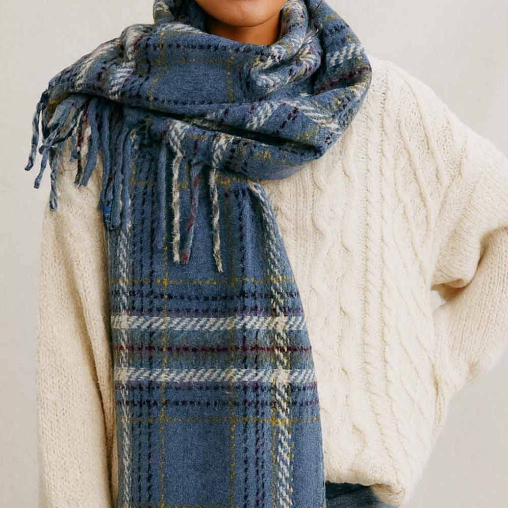 Wrap yourself in warmth and style with this misty blue plaid knit scarf. Crafted from soft, cozy yarn with a classic plaid pattern, it's the perfect layering piece for cooler days. The fringed ends add a charming, finished touch that elevates any outfit. Whether you're heading out for a casual stroll or dressing up your everyday look, this versatile scarf brings both comfort and character to your wardrobe.
Details:
100% Polyester
Casual, light fitting scarf
Size: 40*185cm