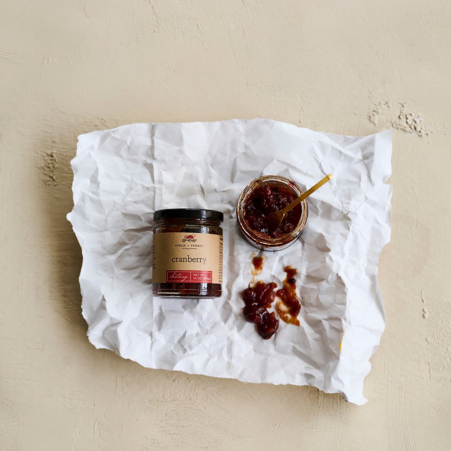 A festive and flavorful chutney featuring tart cranberries balanced with sweet spices, perfect as an accompaniment to roasted poultry, pork, or as an elevated spread on cheese boards and sandwiches. This 10 oz jar is a delightful addition to holiday meals or everyday gourmet cooking.