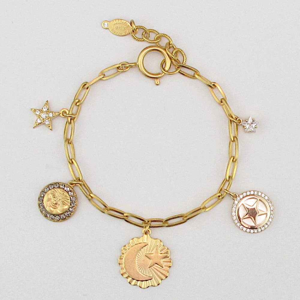 The Sun and Moon and Stars above, mysteries of the universe. 14k gold finish. Charms may vary slightly, but always stay within the theme.