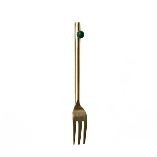 Elevate your table setting with this stunning gold finish stainless steel fork, where timeless elegance meets everyday functionality. The lustrous gold coating adds a touch of sophistication to any meal, while the durable stainless steel construction ensures lasting quality. A charming enameled green ball detail adorns the handle, bringing a pop of color and personality to your dining experience. Perfect for special occasions or everyday use, this fork combines beauty with reliable performance.
