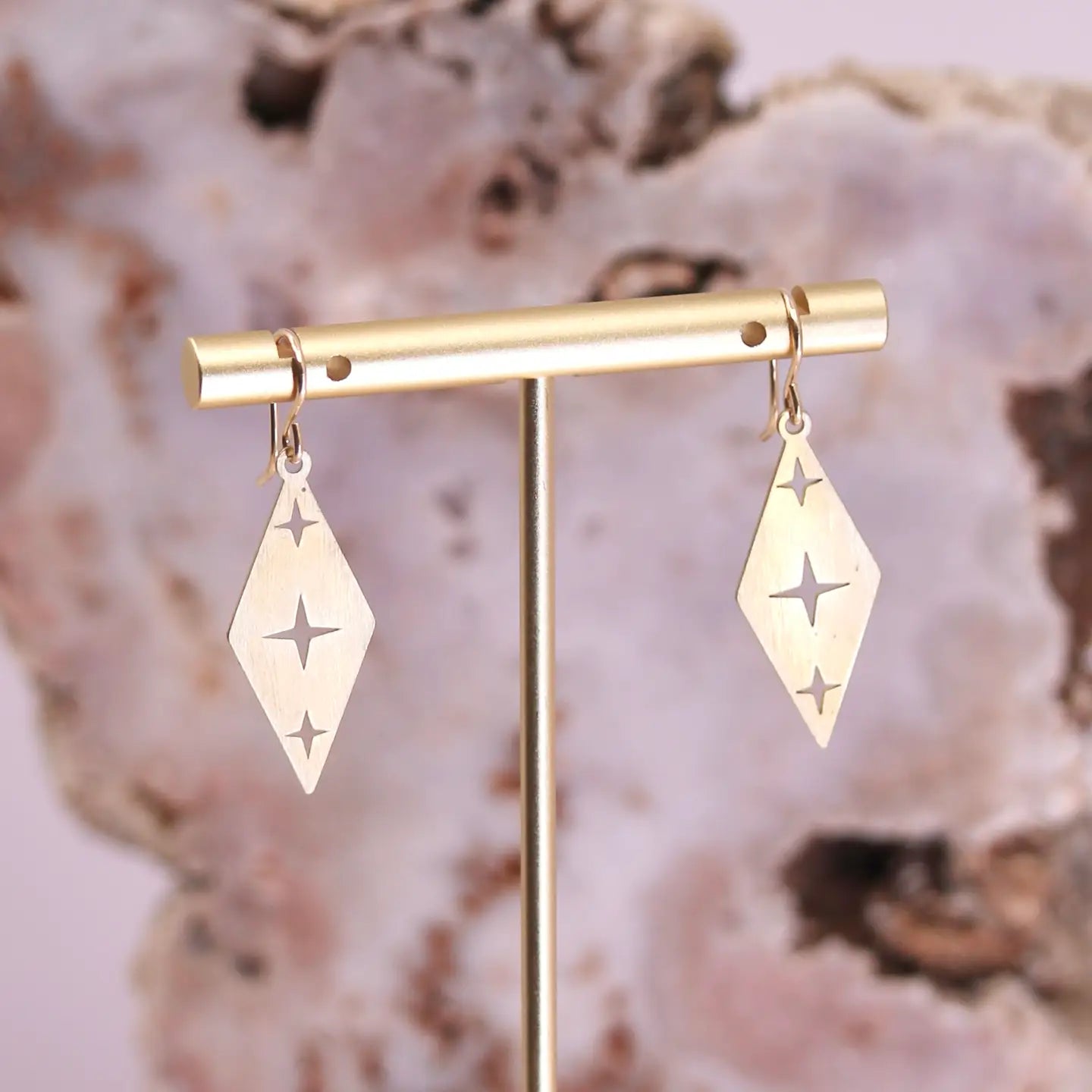Make a stellar impression with the Mineral and Matter Celestial Star Brass Earrings! These charming dangles showcase three four-point stars in perfect alignment, each one intricately carved through precision laser-cutting.
Details:
laser-cut brass charms
goldfill earring hooks
13mm x 30mm