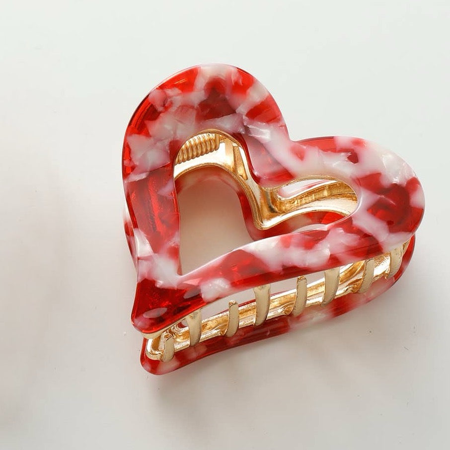 Capture your hair in style with this charming heart-shaped metal claw clip. Perfect for Valentine's Day or everyday wear, this red tortoise accessory combines a playful design with reliable hold. The sturdy metal construction keeps your hair secure without slipping, while the romantic heart silhouette adds a touch of sweetness to any look. Whether you're styling an updo, half-up style, or securing a ponytail, this versatile clip is your go-to accessory for effortless elegance.
Details:
Small (2.4 inch)