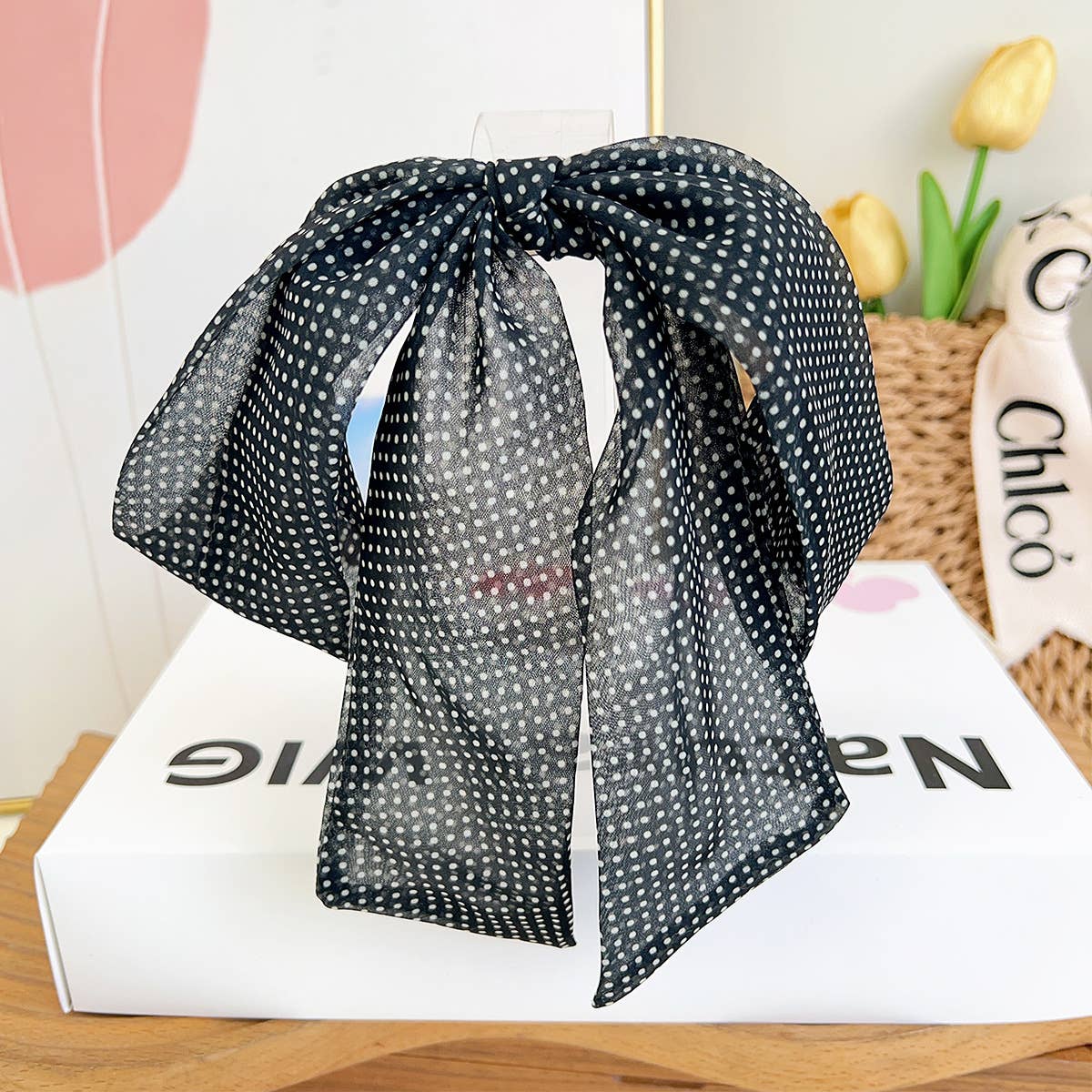 Discover delicate style with this petite French barrette showcasing an adorable white polka dot pattern on a dark background. The silky satin bow features graceful long tails that dance with movement, adding feminine flair to any hairstyle. Its compact size makes it ideal for securing smaller sections, delicate updos, or creating charming accent details. Whether you're dressing up or adding a subtle touch of whimsy to your day, this sweet barrette brings timeless elegance in a perfectly proportioned package