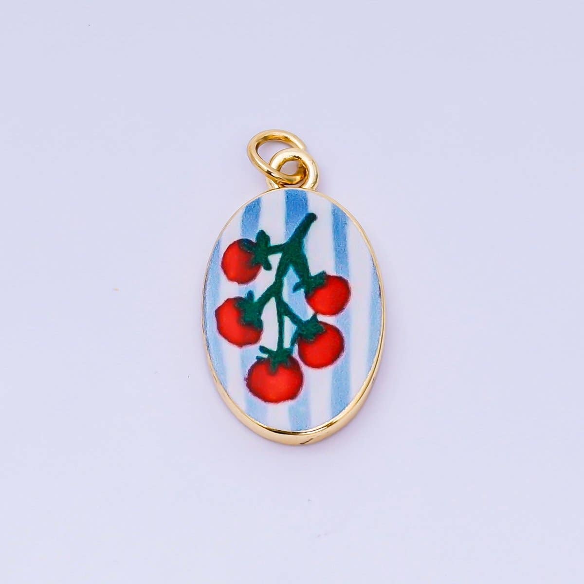 Brighten your jewelry collection with this vibrant Enamel Spring Collection Charm, featuring a fresh tomato design on the front. Crafted from brass and 24K gold-filled materials with beautiful hand-painted enamel detailing, this petite charm measures 23.1mm x 14.1mm x 3.1mm—the perfect size for bracelets, necklaces, or charm collections. Lead-free and nickel-free, it's safe for sensitive skin and designed to last. A delightful accent piece.