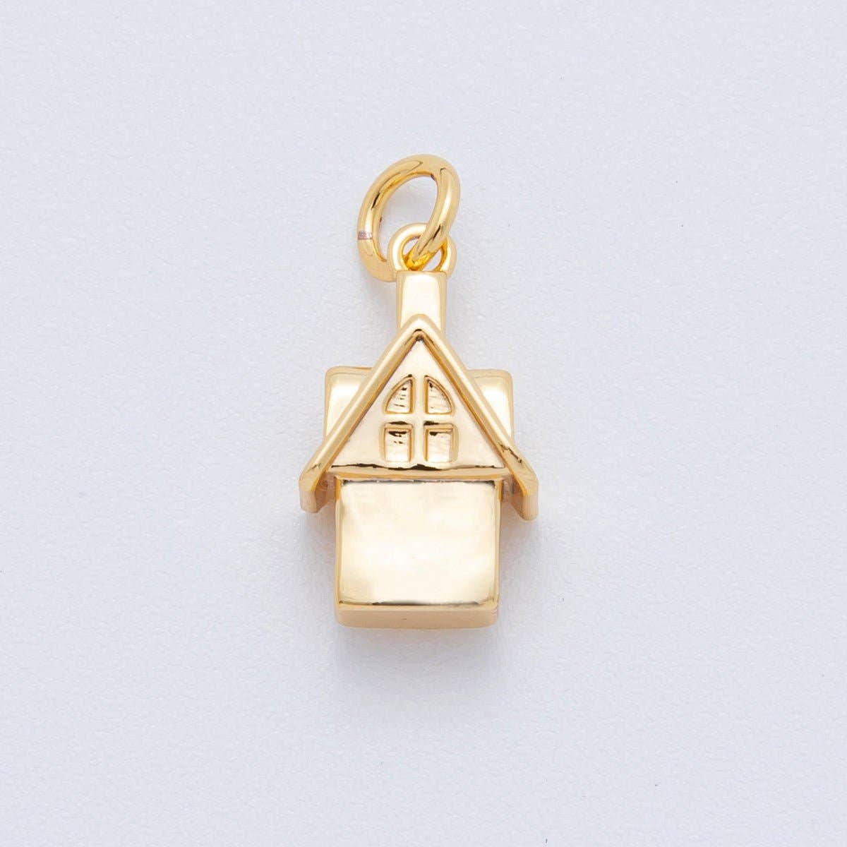 Bring a sense of “home” wherever you go with our 18K Gold Filled Mini House Charm. This sweet, architectural piece is a tiny reminder of where the heart is, designed with a clean and classic silhouette.