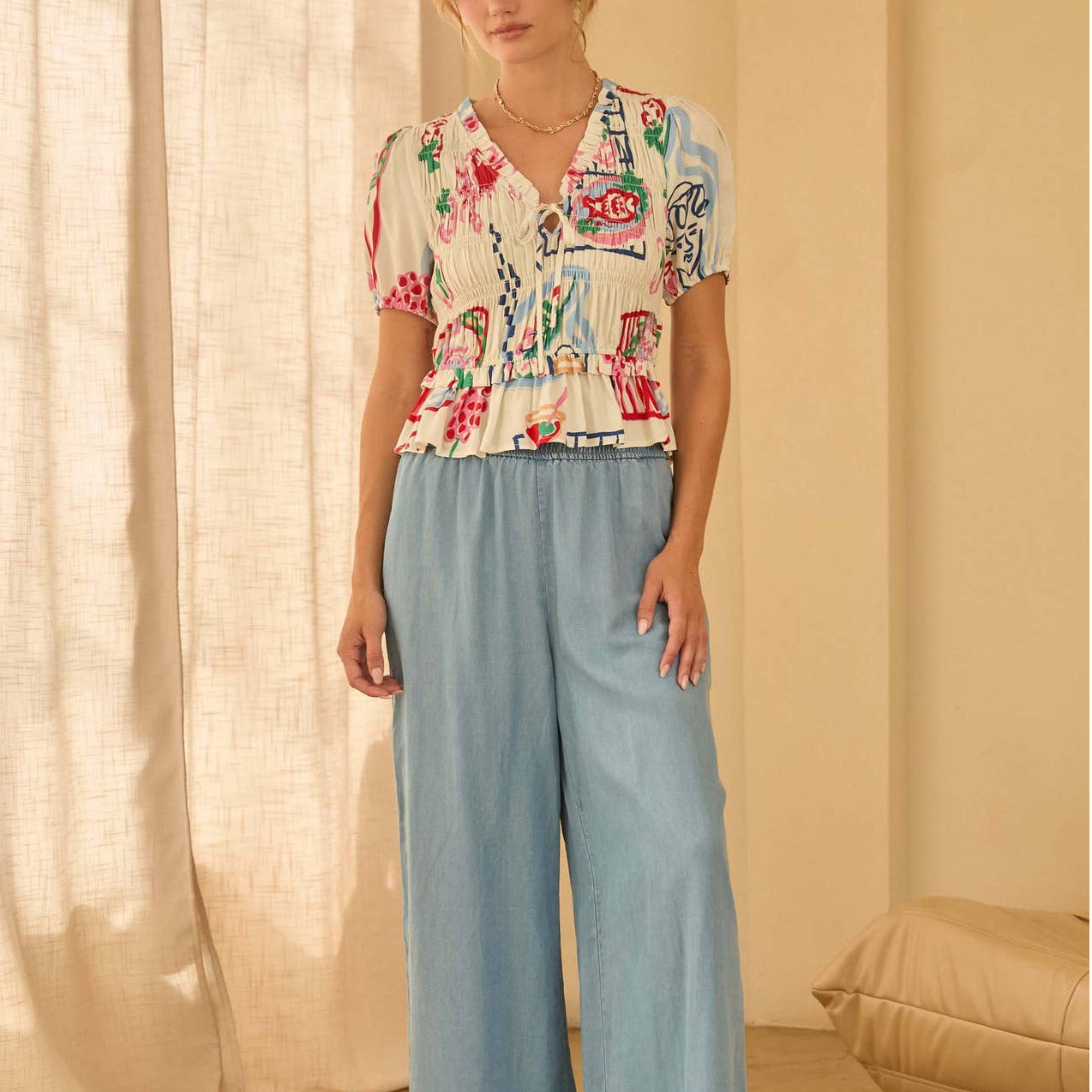 Smocked Short Sleeve Abstract Peplum Top