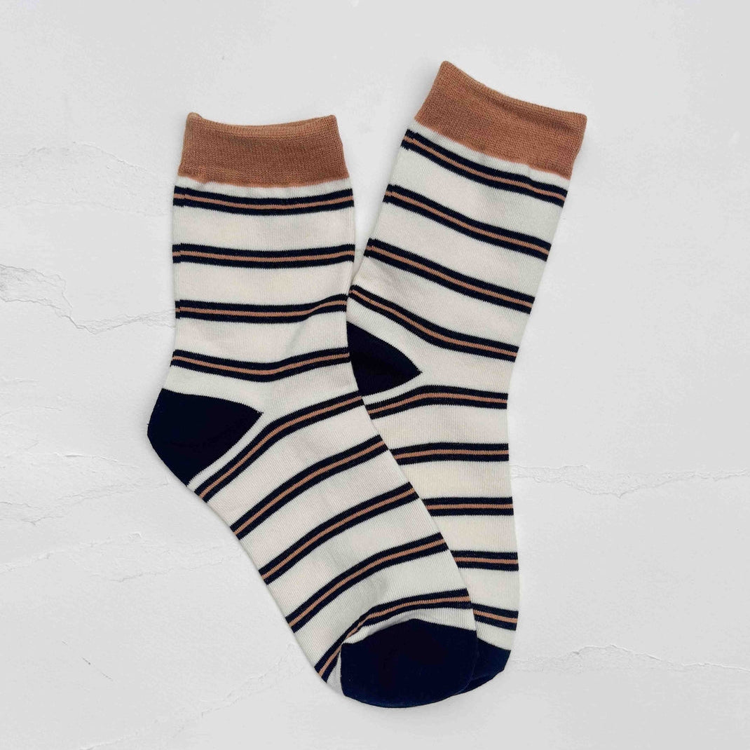 Add a timeless touch to your everyday wardrobe with these soft, comfortable striped crew socks. Featuring a classic stripe pattern with contrasting heel, toe, and cuff colors, they're perfect for casual outfits year-round.