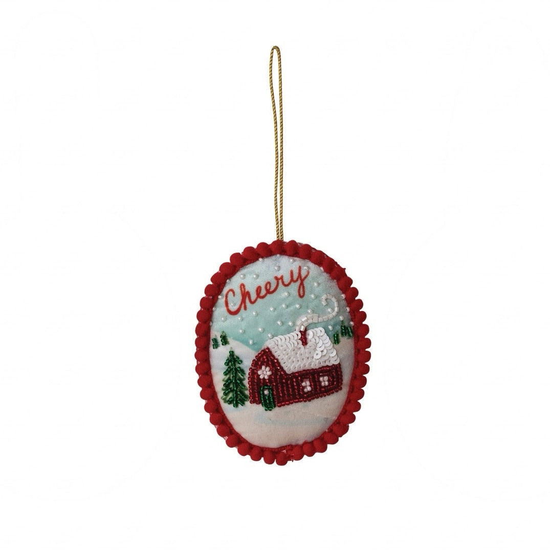 Bring cozy holiday charm to your tree with our Storybook Holiday Beaded Ornament featuring a delightful cheery house design. Intricately crafted with handmade fabric and glass beads, this lovely piece adds a touch of warmth and whimsical sparkle to your festive celebrations.