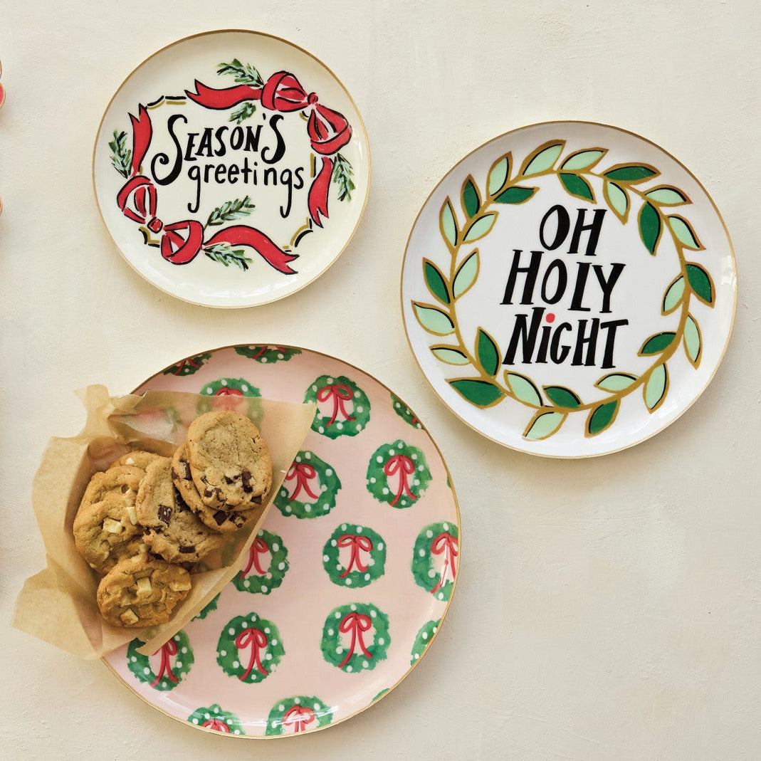 Bring warmth, cheer, and elegant charm to your seasonal gatherings with these Festive Enamel Trays. Beautifully crafted with holiday patterns, festive sayings, and refined gold edges, this set of three versatile sizes makes serving holiday treats and displaying cozy decor effortless. Designed to bring joy and togetherness to your home, they also make a thoughtful, heartwarming gift for someone special.