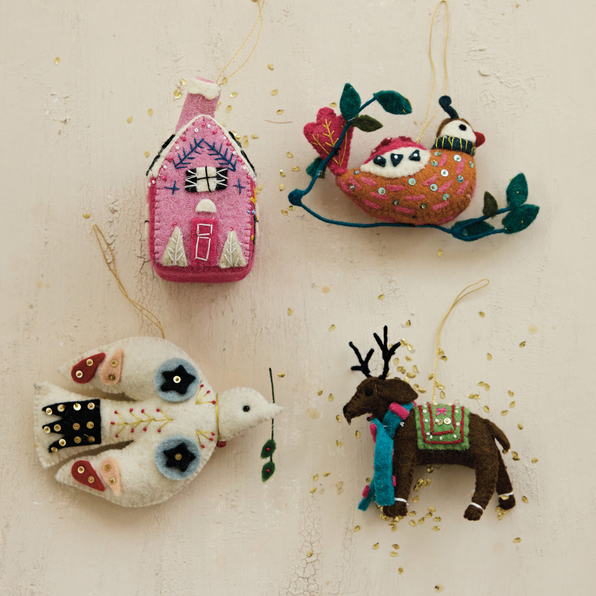 Bring cozy holiday cheer to your home with this charming Winter Whimsy Reindeer ornament. Thoughtfully handcrafted from soft wool felt, it features delicate embroidery, sparkling sequins, and detailed beadwork that add a magical, playful touch to your Christmas tree, festive garland, or holiday gift wrapping.