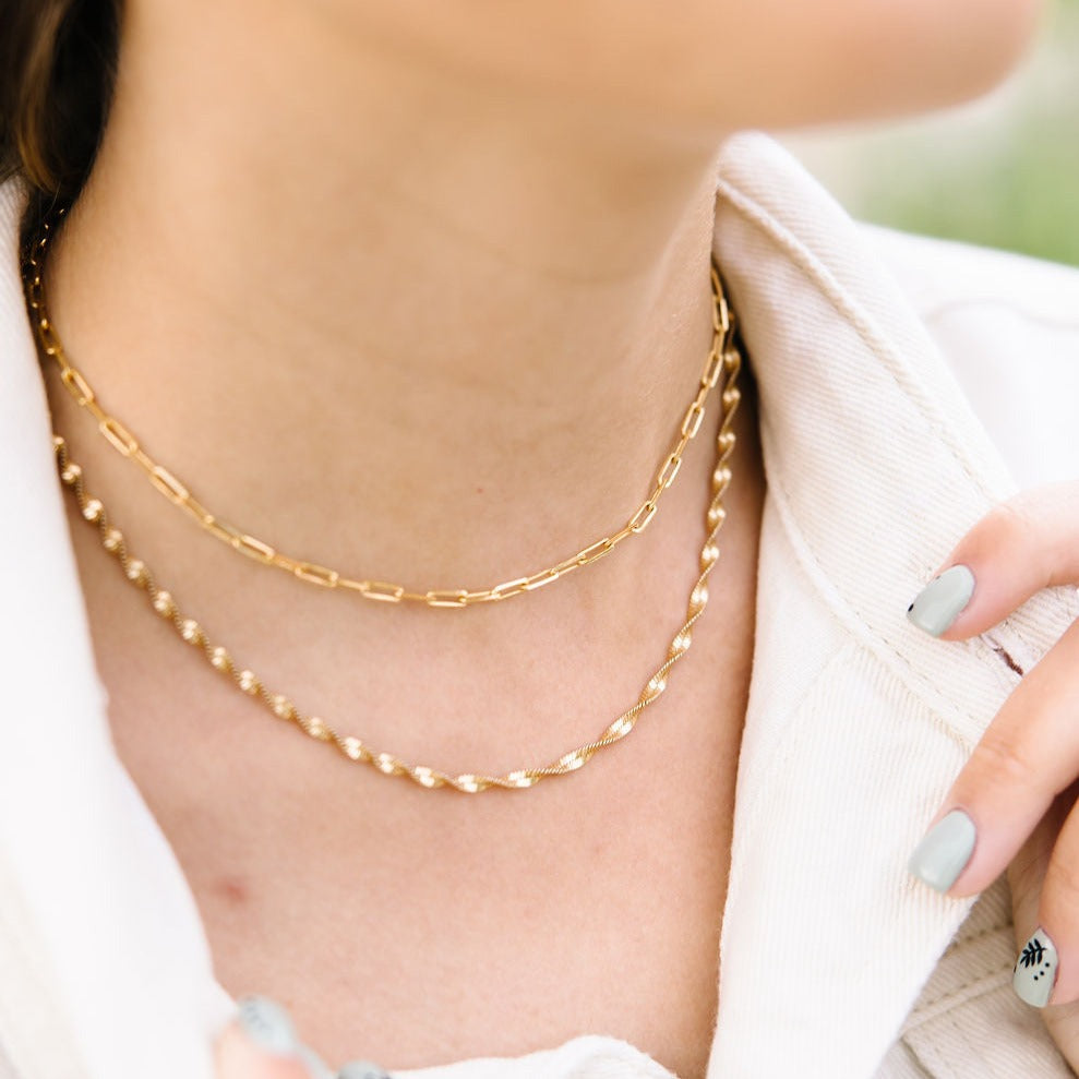The Amelia Gold Filled Twist Necklace is the perfect piece to stack with other necklaces or wear as a stand alone accessory. She’s 18k gold filled, tarnish and wear resistant, and made to last. Hypoallergenic and nickel free, this unique and dainty 3mm chain is the perfect accessory all year long. 16" length.