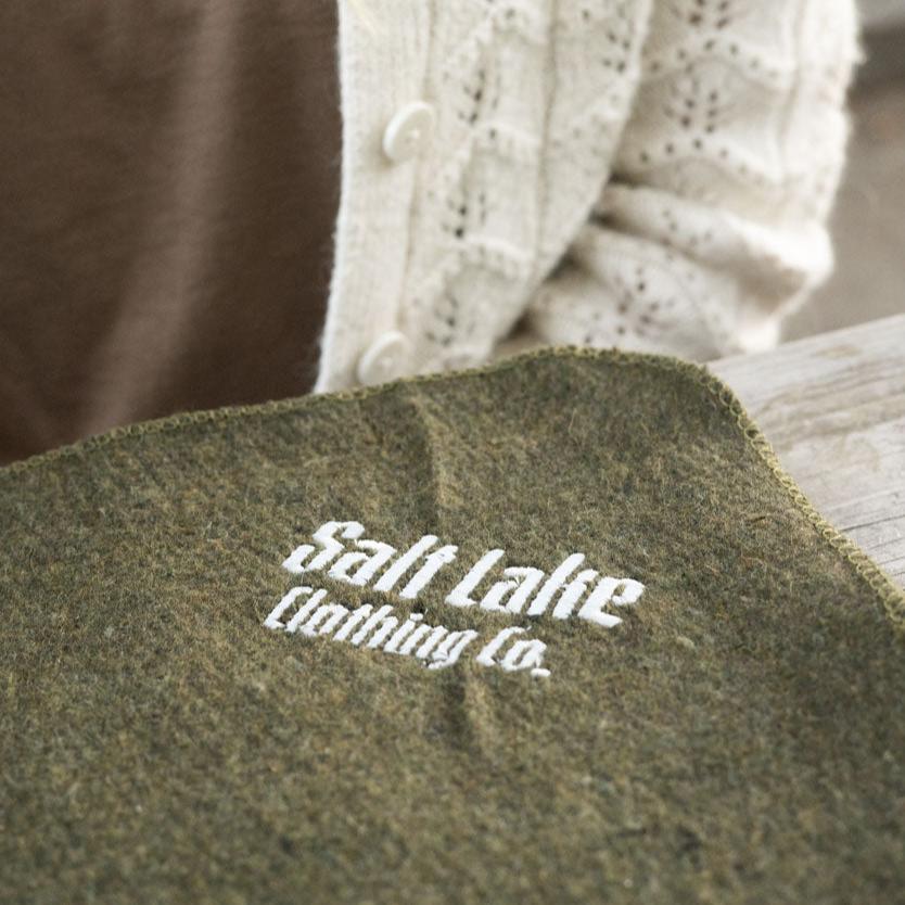 green wool blanket with salt lake clothing co logo