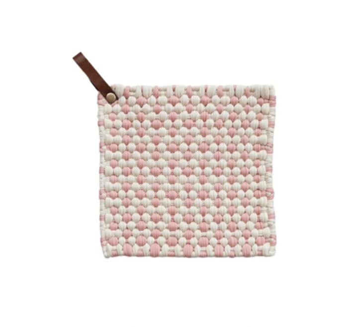 This slight pink and white quare cotton crocheted pot holder with a leather loop is a cozy and rustic addition to the home or office kitchen. It features a square shape and a cotton crocheted design providing protection from hot pots and pans. The holder's leather loop allows easy storage and access.