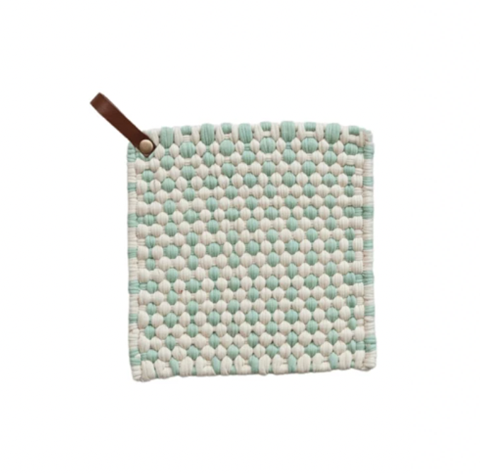 This mint green and white square cotton crocheted pot holder with a leather loop is a cozy and rustic addition to the home or office kitchen. It features a square shape and a cotton crocheted design providing protection from hot pots and pans. The holder's leather loop allows easy storage and access.