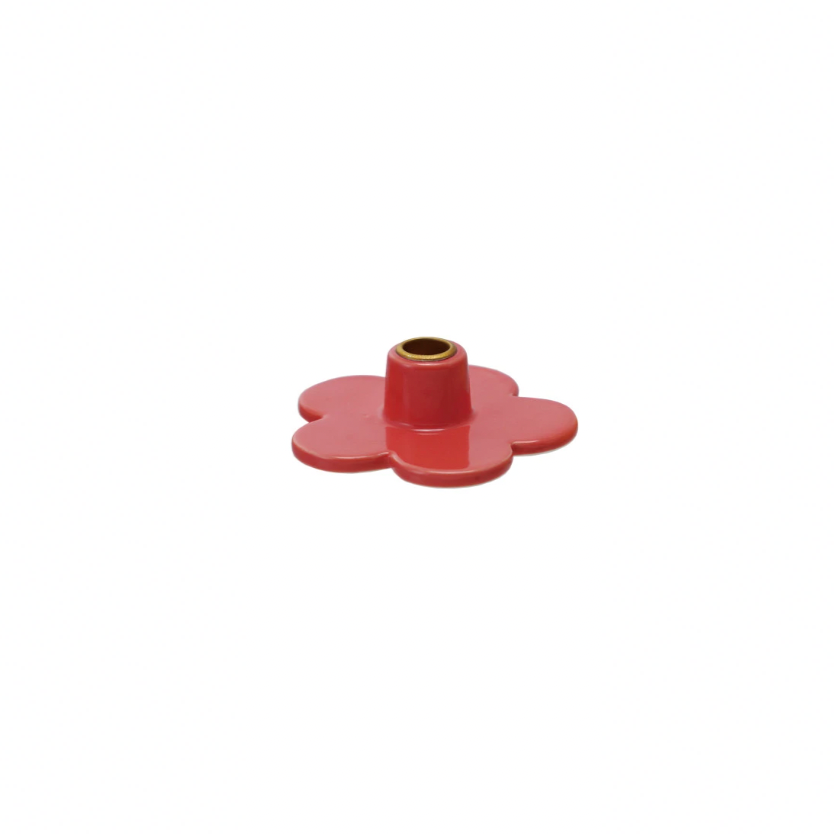 Add a touch of whimsy to your decor with our Stoneware Flower Shaped Taper Holder, available in 3 colors. This holder not only holds your taper candles securely, but also doubles as a charming tabletop accent. Brighten up any room with this playful and unique piece! 3"L x 3"W. Red