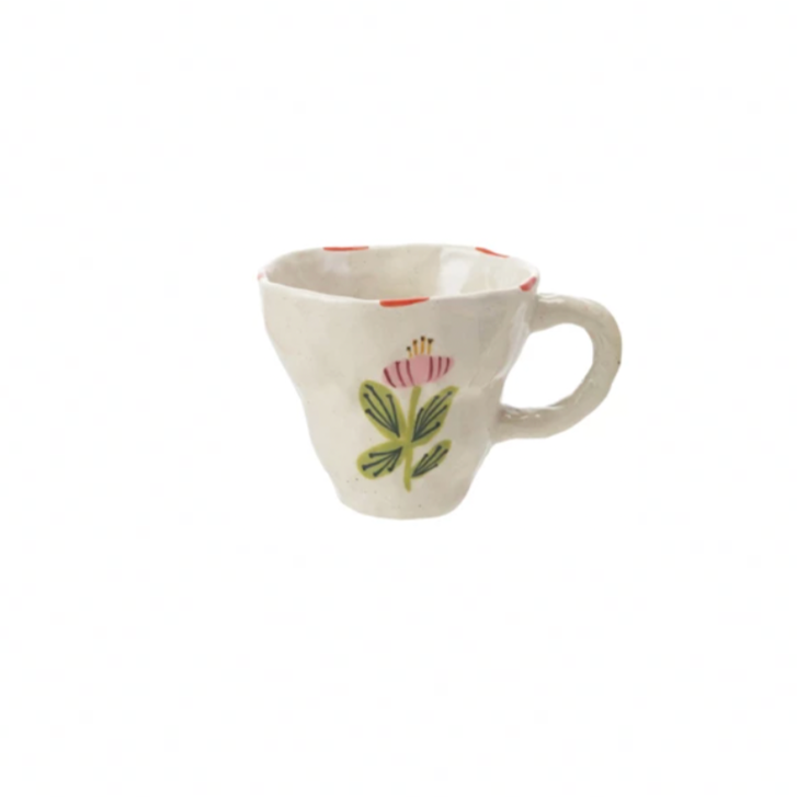 Brighten your day with this charming hand-painted stoneware mug, featuring a delightful whimsical pink flower design. Perfect for sipping your favorite brew, it adds a splash of joy and a touch of nature to every coffee break. Durable and unique, this mug turns ordinary moments into playful celebrations. 10 oz. 4-1/2" Round x 3-1/2"H