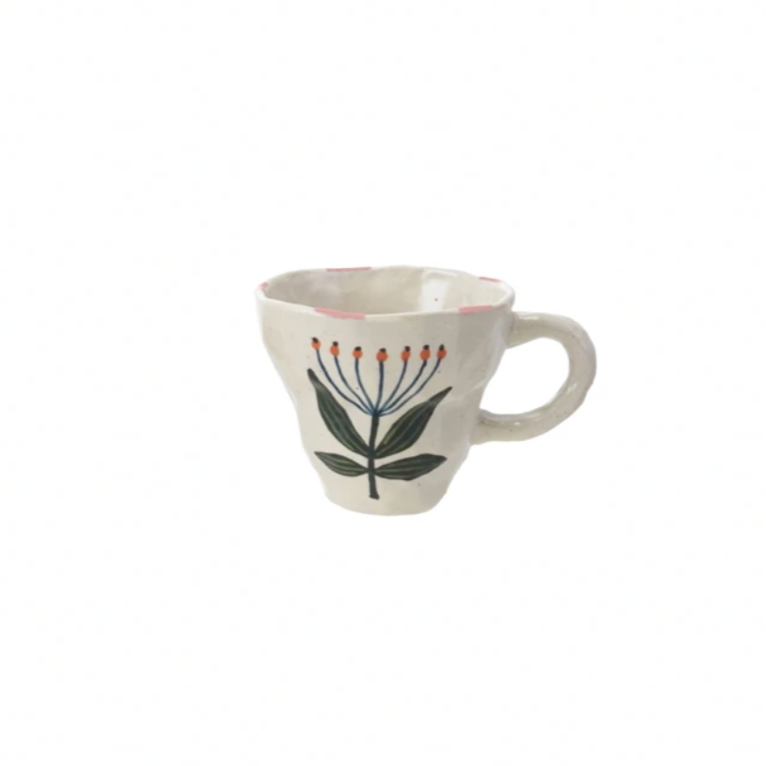 Brighten your day with this charming hand-painted stoneware mug, featuring a delightful whimsical Blue & pink flower design. Perfect for sipping your favorite brew, it adds a splash of joy and a touch of nature to every coffee break. Durable and unique, this mug turns ordinary moments into playful celebrations. 10 oz. 4-1/2" Round x 3-1/2"H