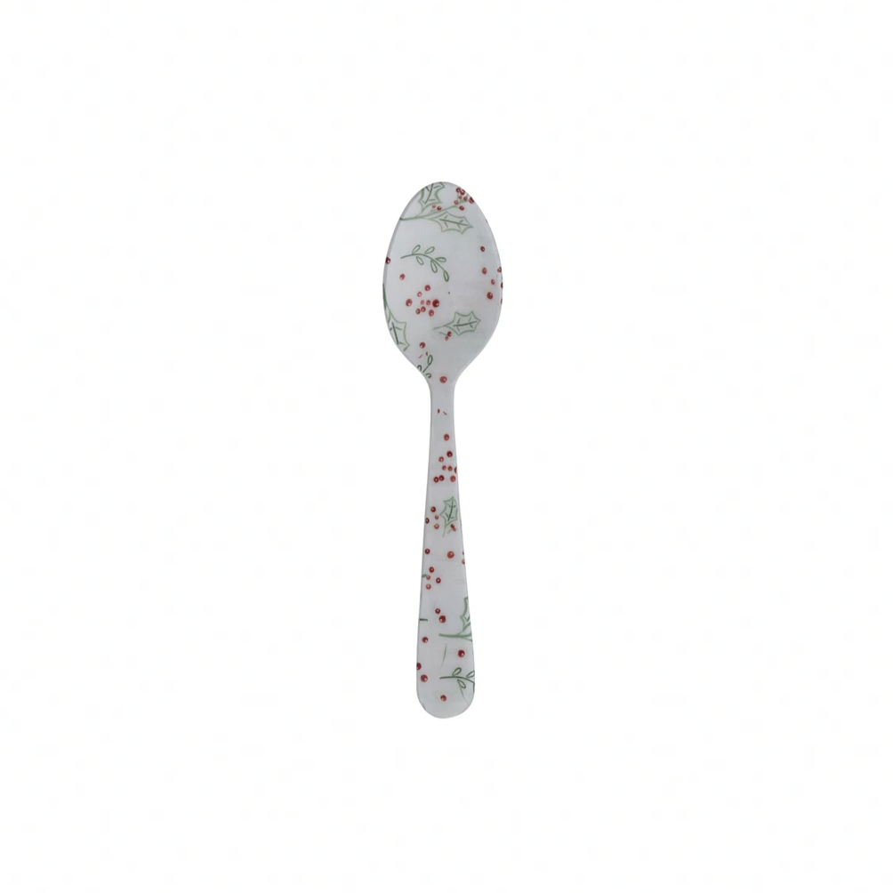 Decorative spoon with floral pattern on a white background