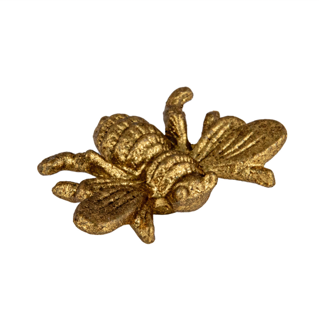 Gold bee-shaped magnet on a white background