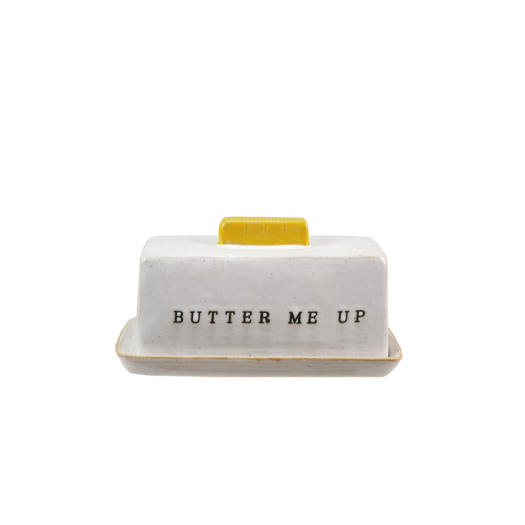 Butter dish with 'BUTTER ME UP' text on a white background