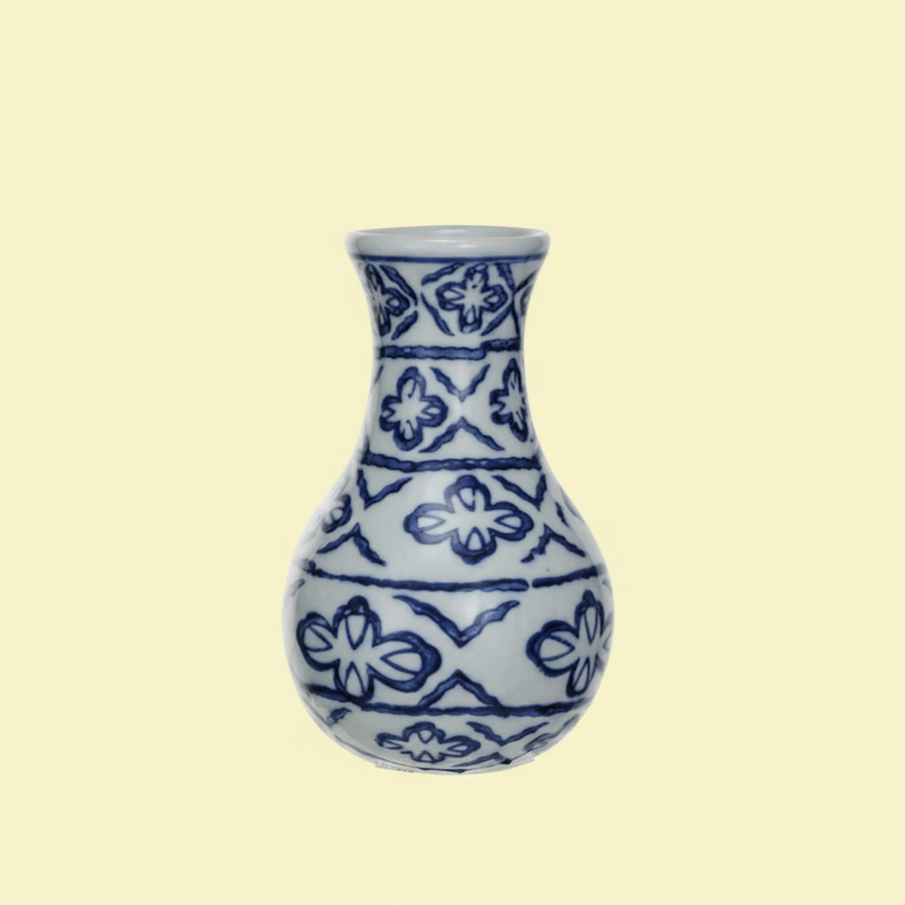Ceramic vase with blue floral abstract patterns on a white background