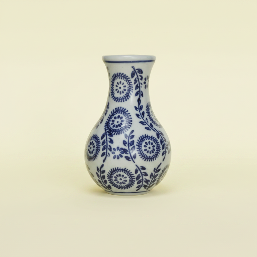 White vase with blue floral patterns on a white background