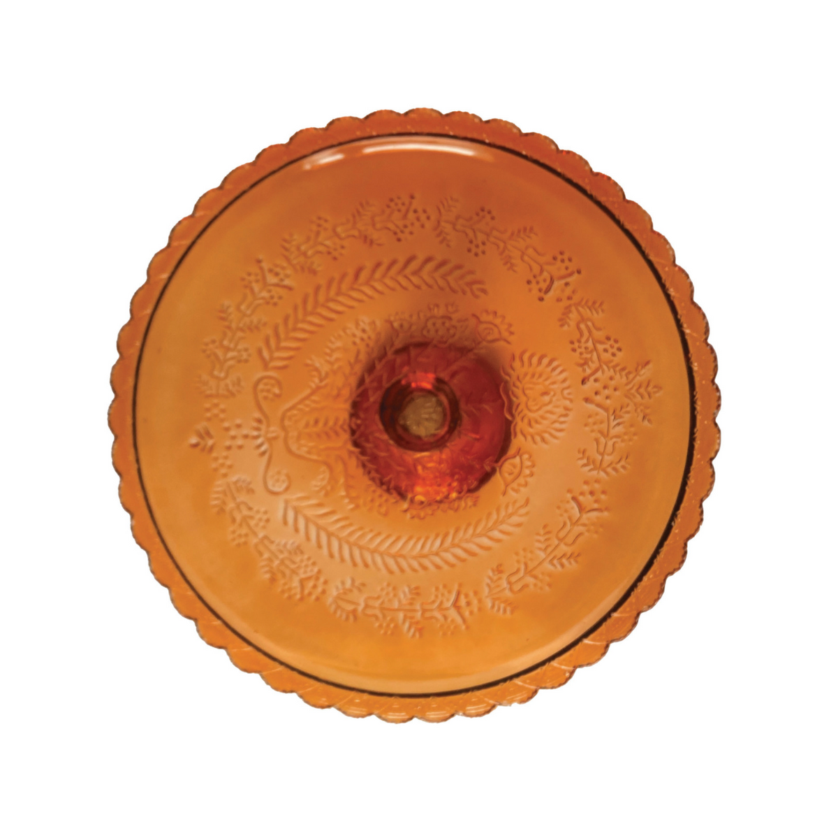 An amber glass pedestal cake stand with a scalloped rim and a round base, shown on a plain white background.